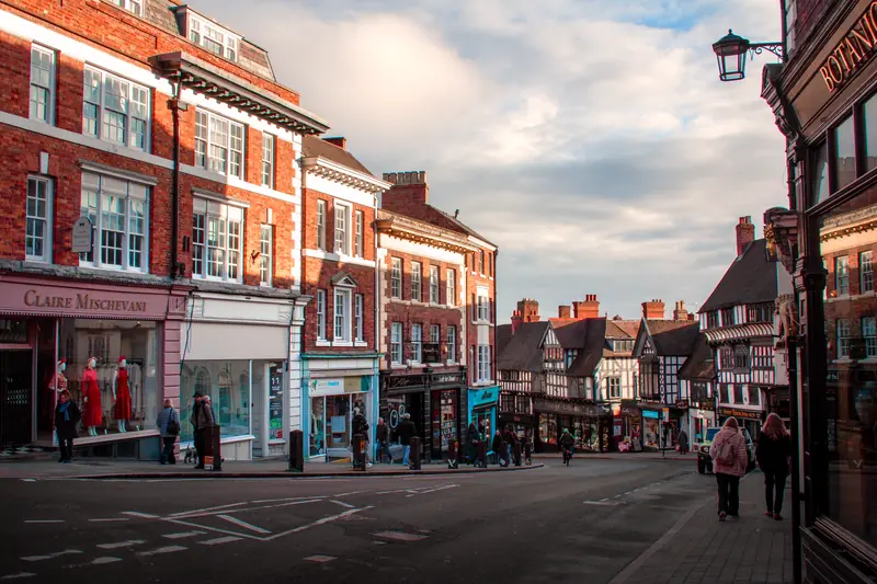 A British town street lined with independent shops